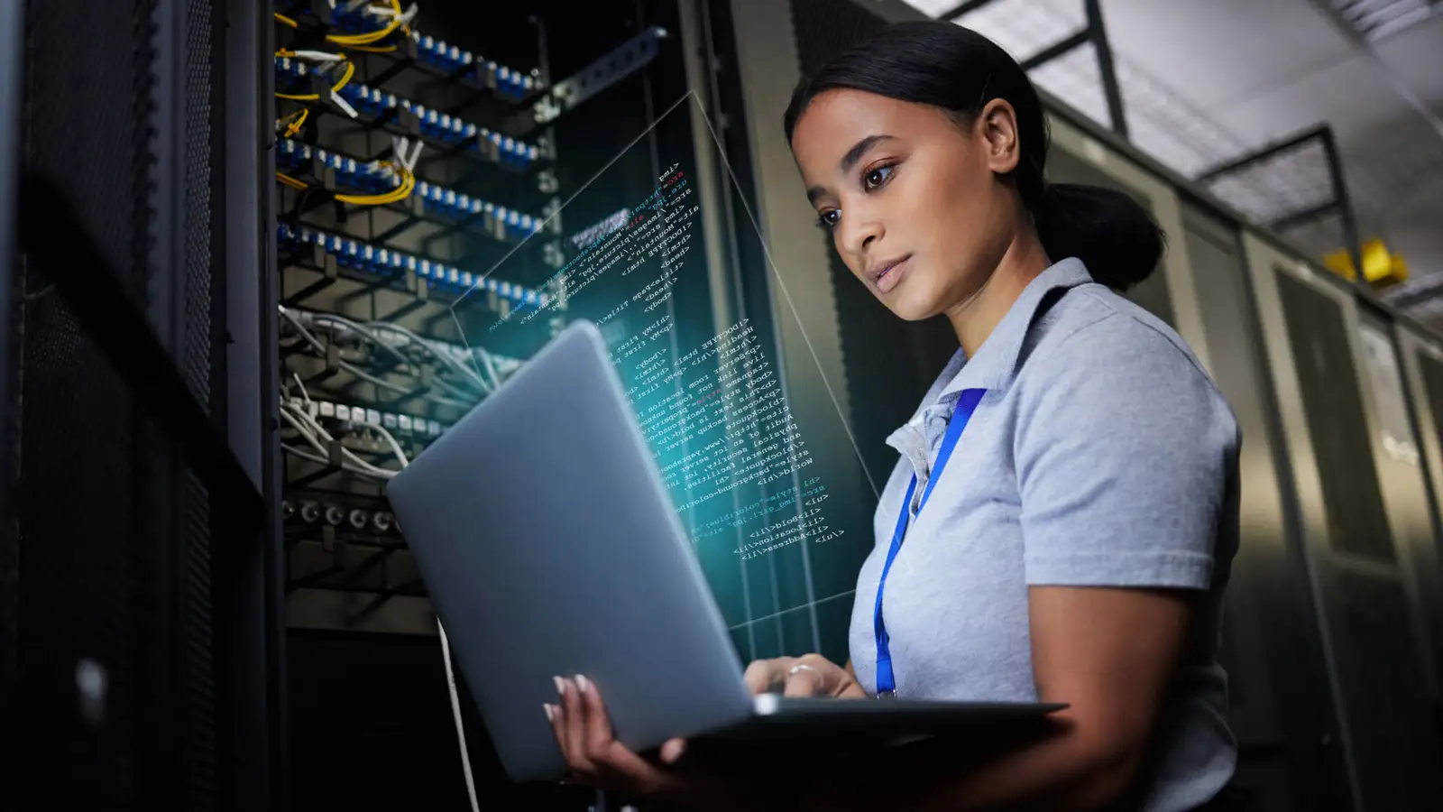 Woman looking a tablet in a data centre
